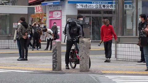 TOKYO, JAPAN : Uber Eats food delivery at the street. Stock Footage 129493096