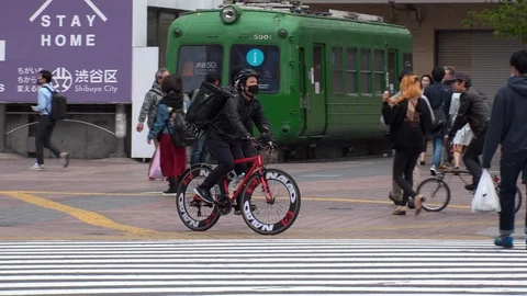 TOKYO, JAPAN : Uber Eats food delivery at the street. Stock Footage 129493359