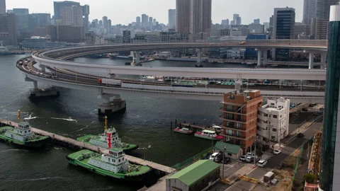 Tokyo Junction in front of Rainbow Bridge cityscape Japan time lapse Stock Footage 114633229