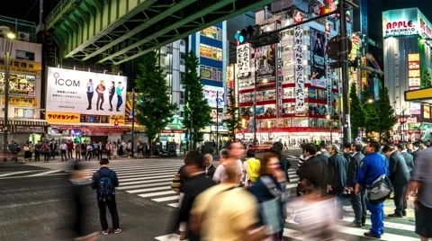 Tokyo - Night street view with people crossing street at Akihabara. Time lapse. Stock Footage