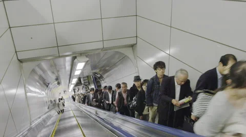 Tokyo Station Escalator to the Train Platform Stock Footage 64381521