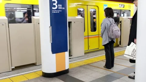 TOKYO TRAIN COMMUTERS Stock Footage 84494298