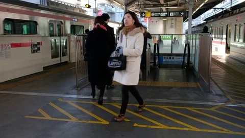 TOKYO TRAIN COMMUTERS Stock Footage 84505632