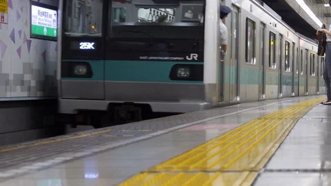 Tokyo train departing Stock Footage 121576776