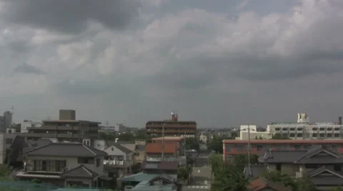 Tokyo train pulls into a station in the countryside Stock Footage 39594471