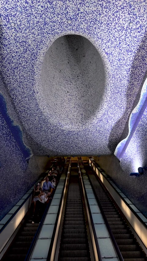 Toledo Metro Station Escalators Beneath Mosaic Tunnel Ceiling Stock Footage 345318788
