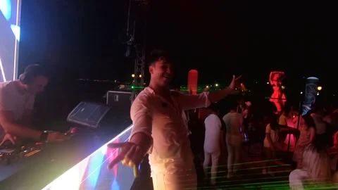 Tolga18A man is actively dancing and posing for the camera at a disco Video stock 144285617