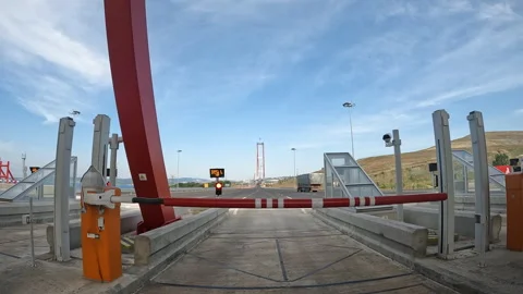 Toll booth against clear blue sky marking highway entrance 動画素材 327308679