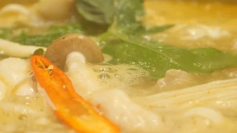 Tom Yum soup is boiling in a pot on the kitchen Video stock 75644590
