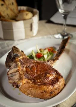 Tomahawk cut plate. Selective focus. Stock Photos
