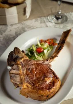 Tomahawk cut plate. Selective focus. Stock Photos