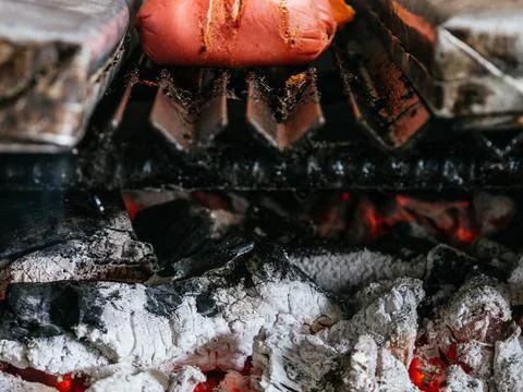 Tomahawk rib beef steak on hot black grill with flames Stock Photos