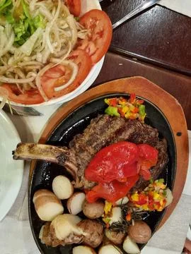 Tomahawk steak and vegetable salad Stock Photos