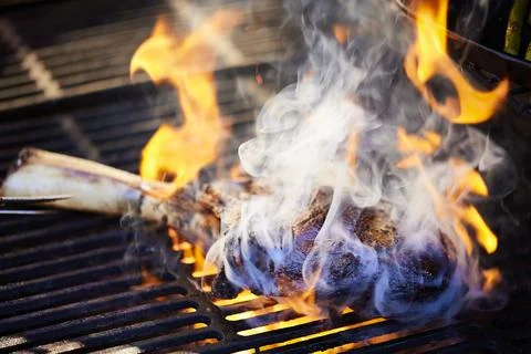 Tomahawk Steak on a Grill Stock Photos