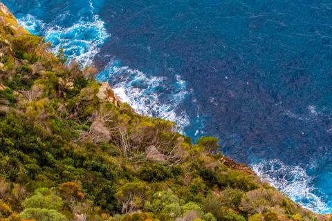 Tomaree Mountain rises dramatically above Shoal Bay Stock Photos