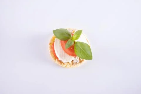 Tomato, basil and mozzarella on a corn waffle Stock Photos