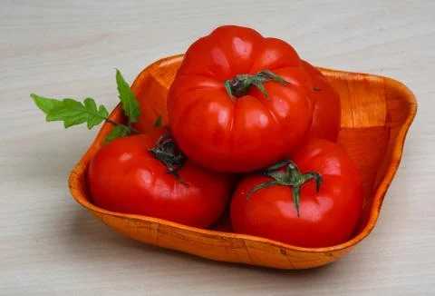 Tomato in the basket Stock Photos
