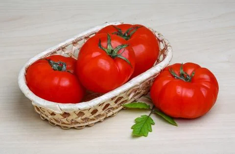 Tomato in the basket Stock Photos