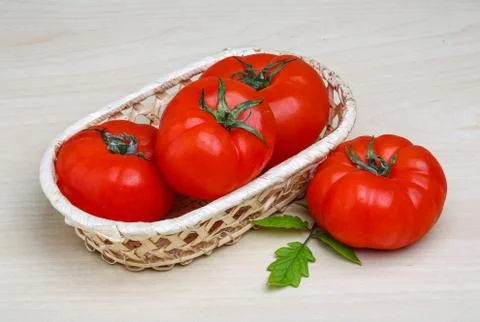 Tomato in the basket Stock Photos