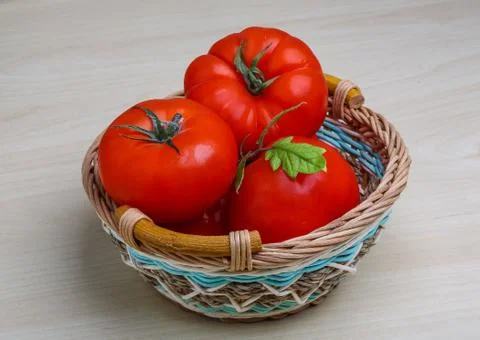 Tomato in the basket Stock Photos