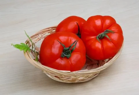 Tomato in the basket Stock Photos