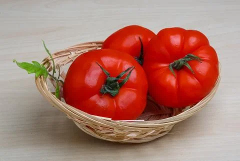 Tomato in the basket Stock Photos