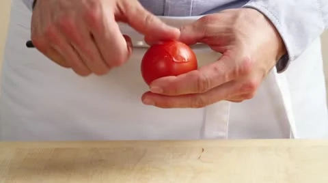 A tomato being peeled Video stock 24673187