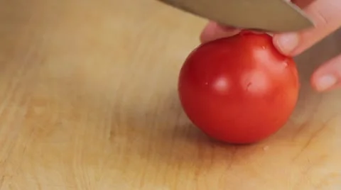 A tomato being quartered Stock Footage 24656915