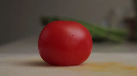 A tomato being sliced Stock Footage