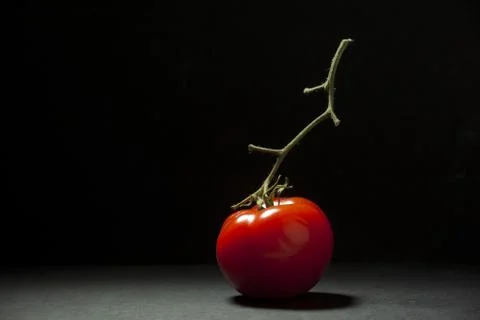 Tomato on black background 库存照片