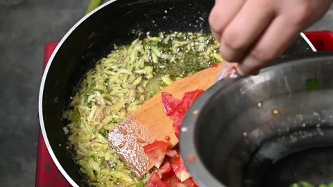 Tomato, chilli. onion cooking in pen on hot oil Stock Footage 203477277