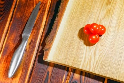 Tomato on a chopping Board as background 写真素材