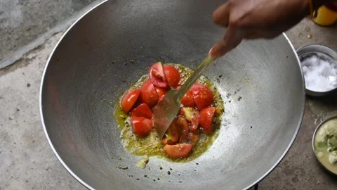 Tomato chutney is being prepared in a pan. Stock Footage 321824764