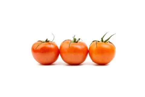 Tomato closeup on white background. Selective focus Photos