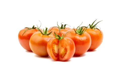 Tomato closeup on white background. Selective focus Stock Photos
