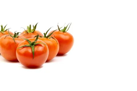 Tomato closeup on white background. Selective focus 写真素材