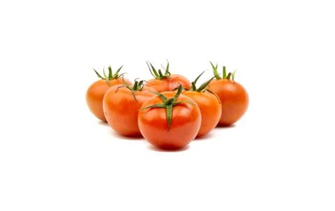 Tomato closeup on white background. Selective focus Stock Photos