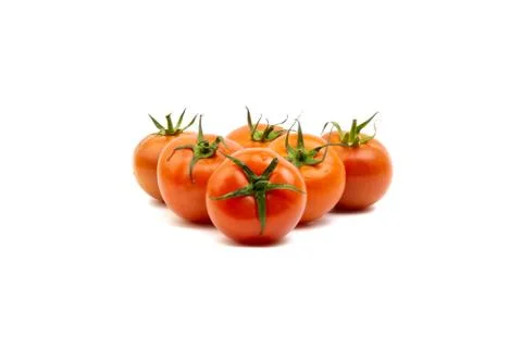 Tomato closeup on white background. Selective focus Photos