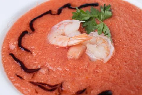 Tomato cream soup with prawns Stock Photos