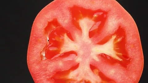 Tomato Cross Section Dolly Left To Right Macro Close Up Black Background Stock Footage 325434811