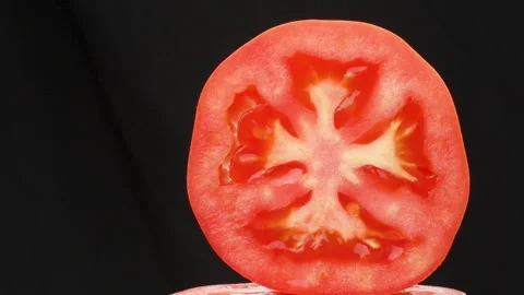 Tomato Cross Section Dolly Left To Right Macro Close Up Black Background Stock Footage 325434824