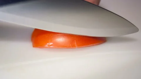 Tomato cuts to slices on white background Stock Footage 68311007