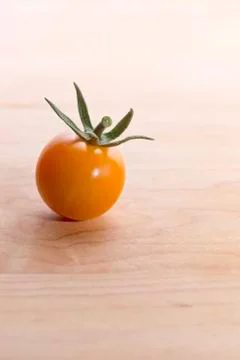 Tomato on Cutting Board Stock Photos
