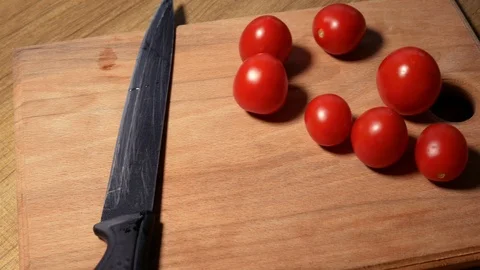 Tomato cutting closeup on the table Video stock 122693282