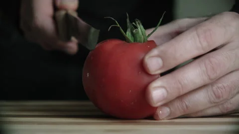 Tomato cutting on a cutting board Stock Footage 132217407