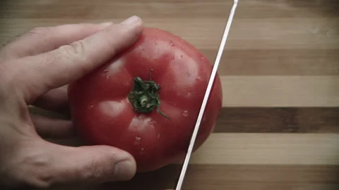 Tomato cutting on a cutting board Stock Footage 132217751
