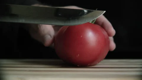 Tomato cutting on a cutting board Stock Footage 132217860