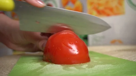 Tomato cutting Stock Footage 127838807