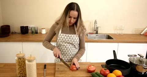 Tomato cutting Stock Footage 169453495
