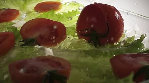 Tomato drop down in water with splashing Stock Footage 71449905